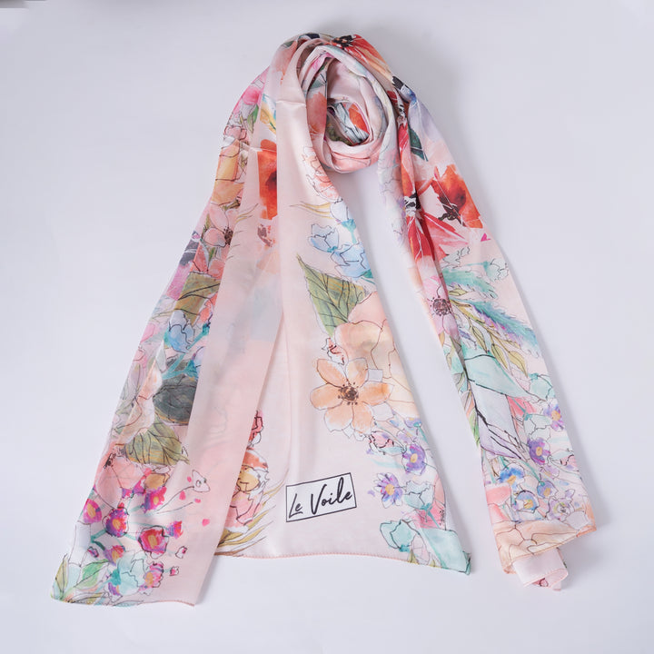 Floral scarf with 'Le Voile' branding on a white background