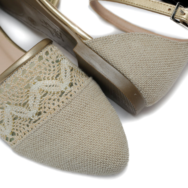 beige flat shoe with detailed lace and stitched toe