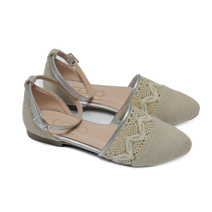 beige flat shoe with detailed lace and stitched toe